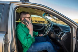 Man on phone in car